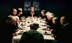 Screenshot from Babette's Feast - Group at dining table.