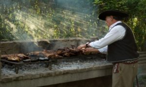 Man making Argentenian barbecue.