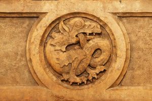 Dragon carving on fireplace mantle