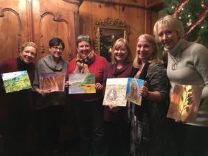 Women holding paintings.