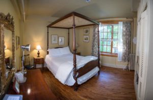 Amelia Earhart bedroom with four post queen bed with canopy