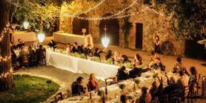 Outdoor evening wedding reception in Tuscany.