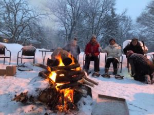 Group at winter bonfire.