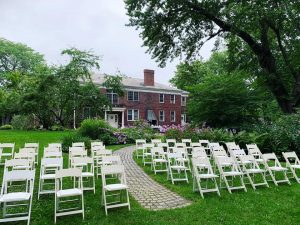 Wedding ceremony guest seating and Lodge exterior.